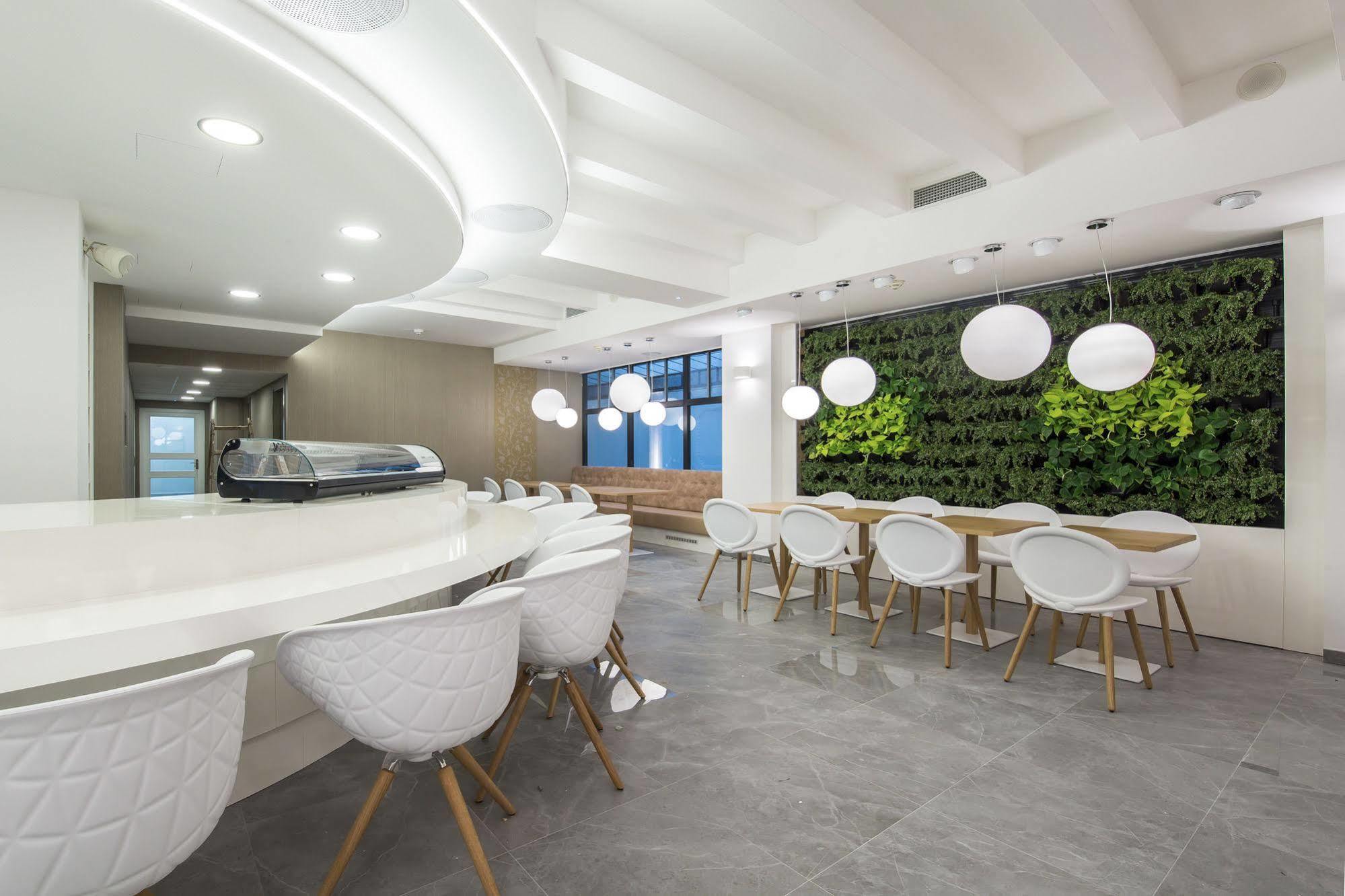Merchants Crown Suites And Spa Prague Exterior photo The Green Wall at the 10th floor of the building