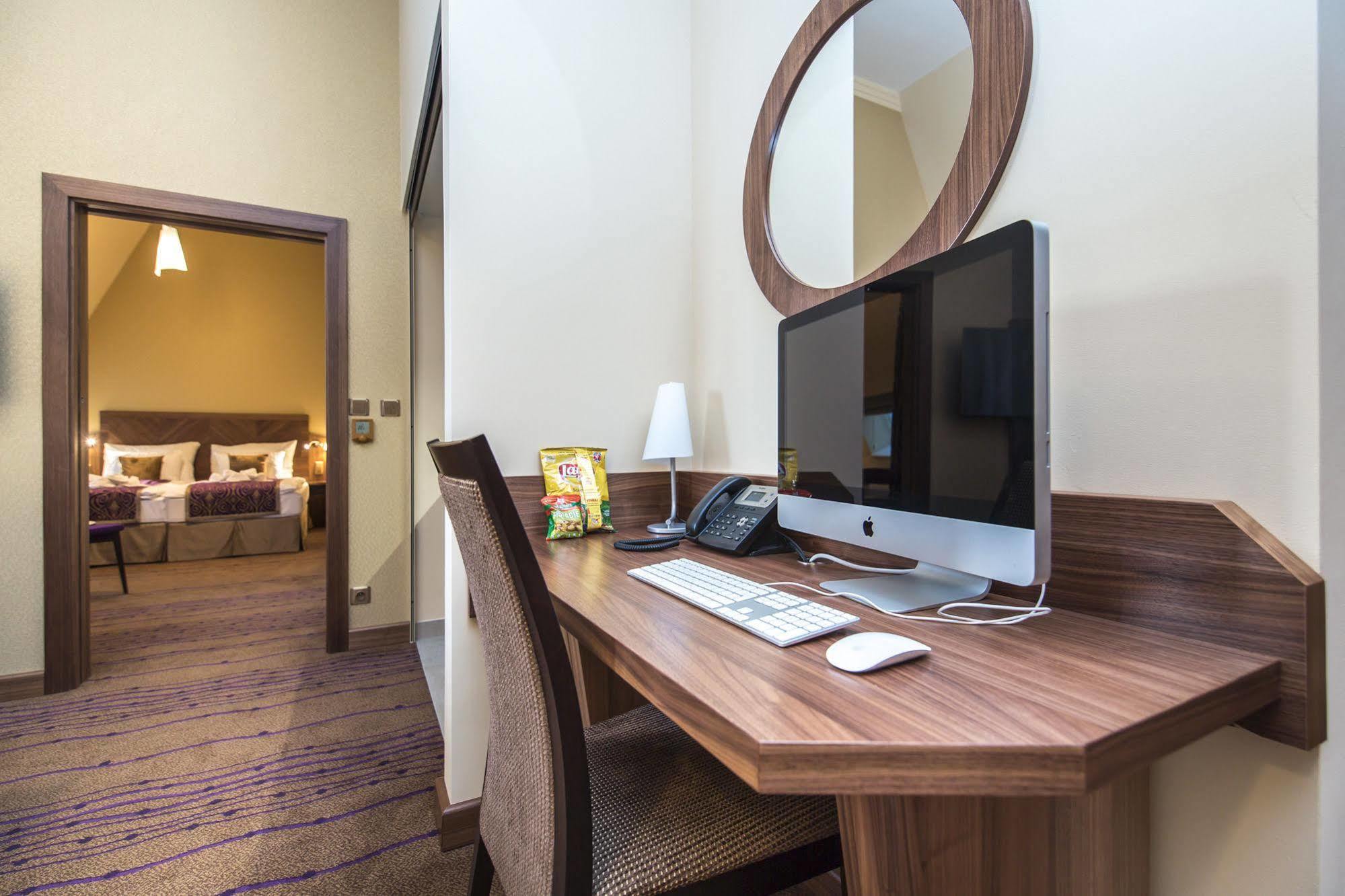 Merchants Crown Suites And Spa Prague Exterior photo A computer in a hotel room